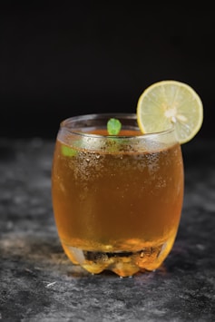 clear drinking glass with orange juice