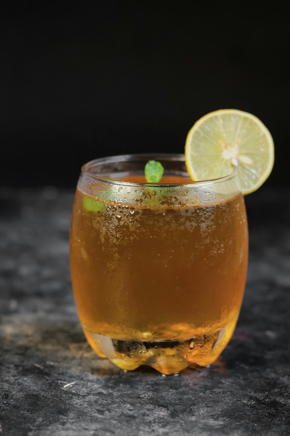 clear drinking glass with orange juice