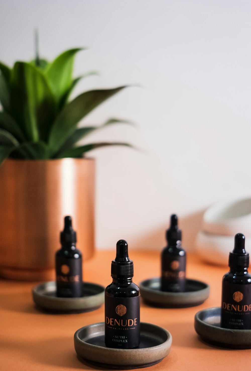 black bottles on brown wooden table