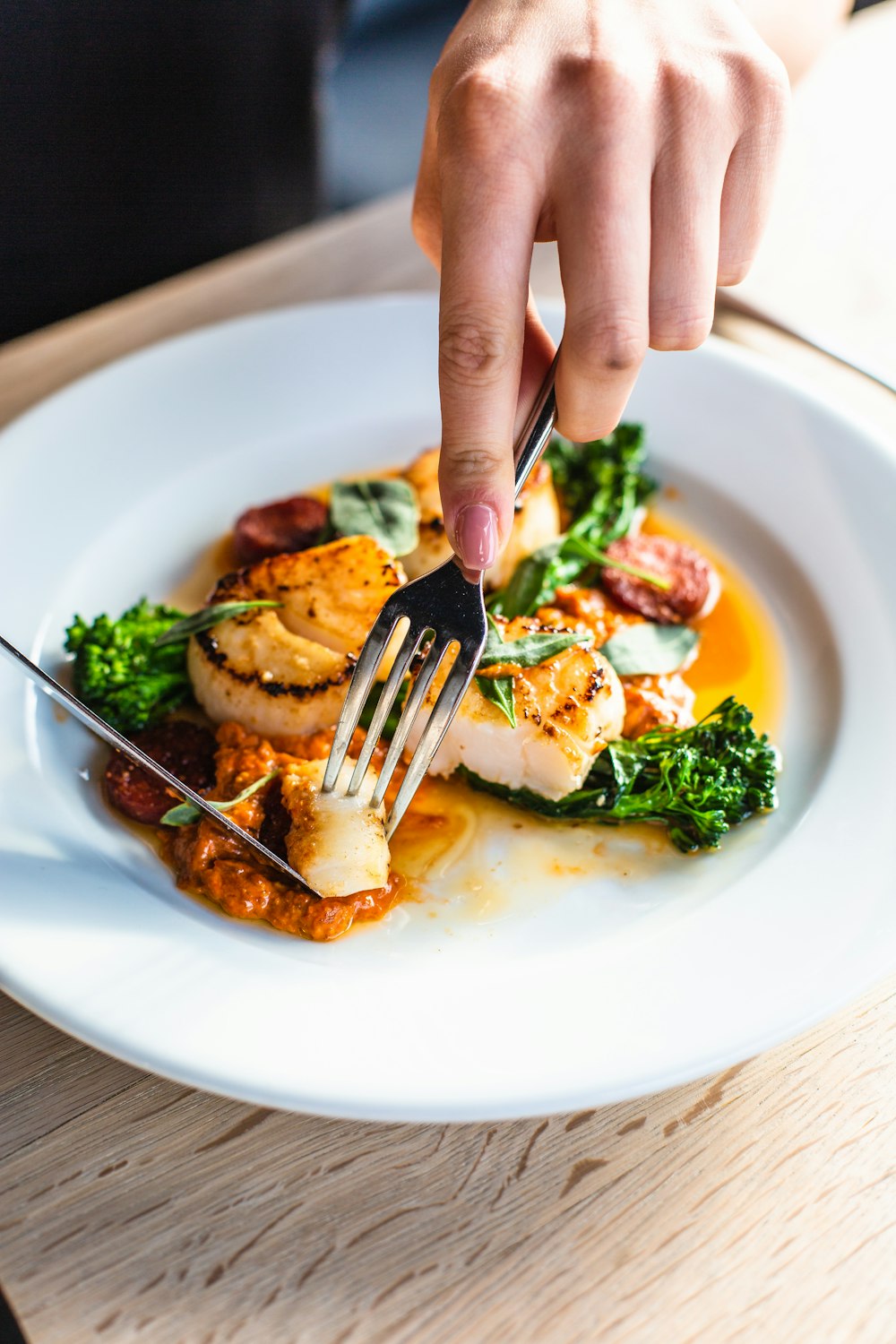 stainless steel fork on white ceramic plate