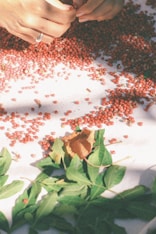 red and black beads on white ceramic plate
