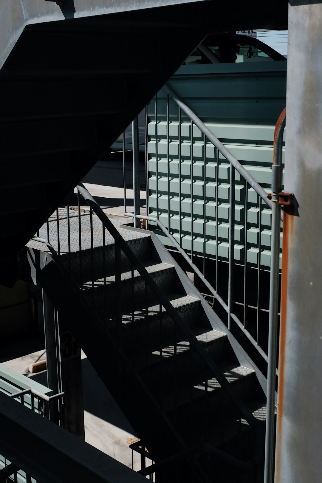 black and white staircase with orange handle