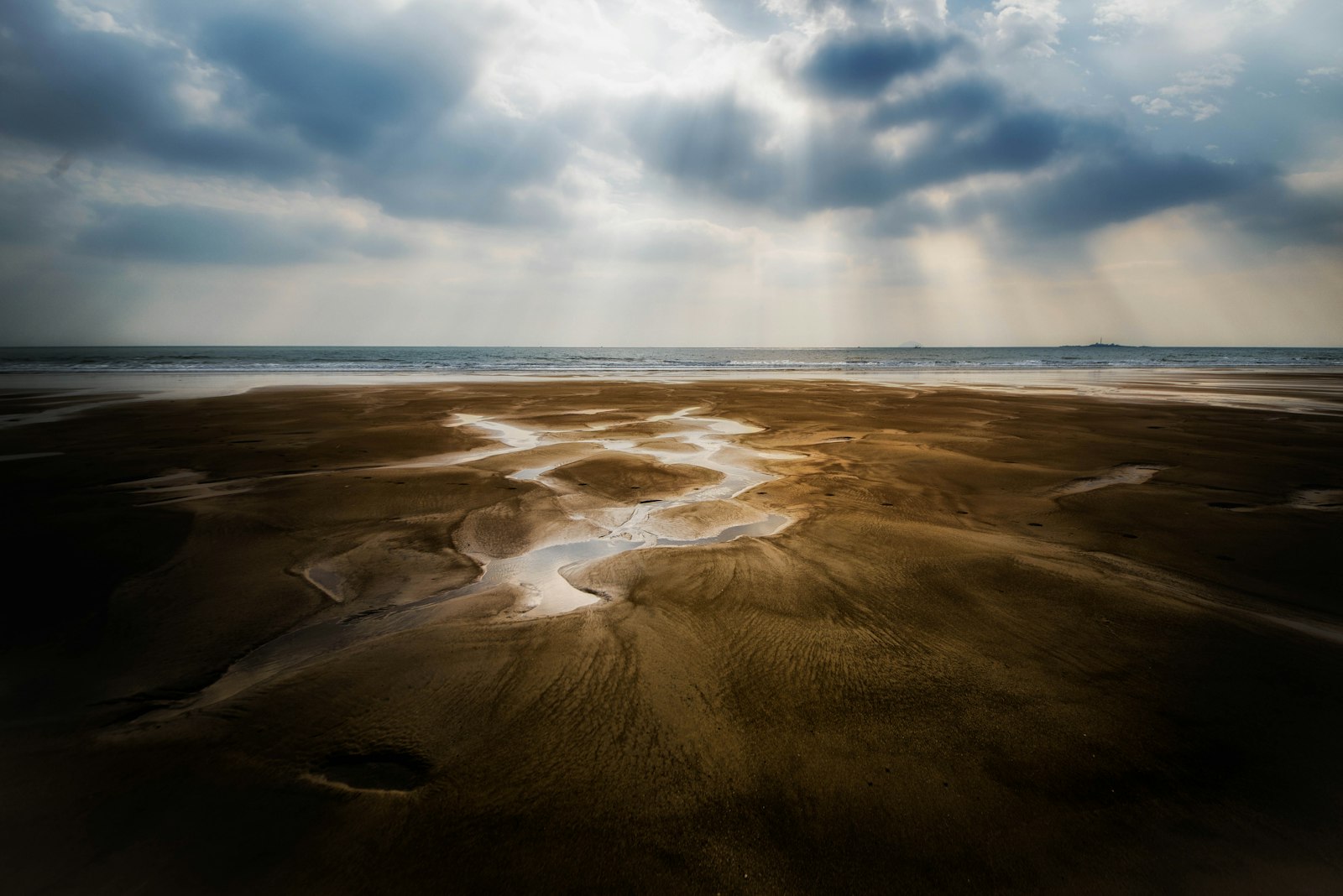 Sigma 12-24mm F4.5-5.6 II DG HSM sample photo. Brown sand under white photography