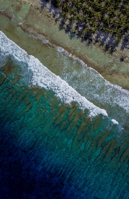 aerial view of ocean waves in Kulhudhuffushi Maldives