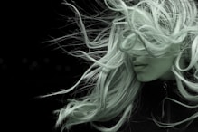 woman with white hair in black shirt
