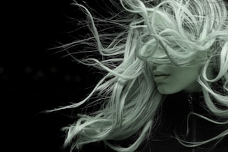 woman with white hair in black shirt