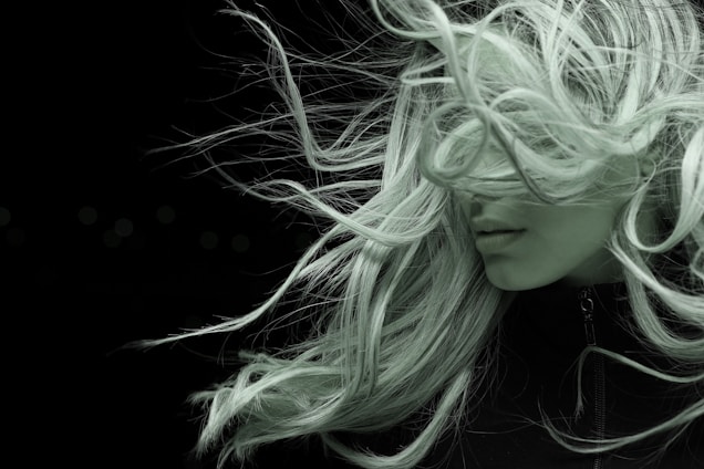 woman with white hair in black shirt