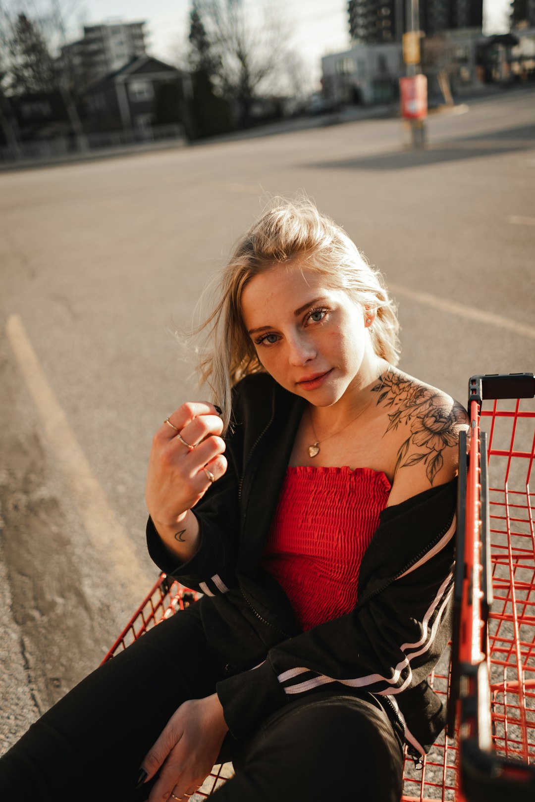 woman in red and black dress sitting on red chair