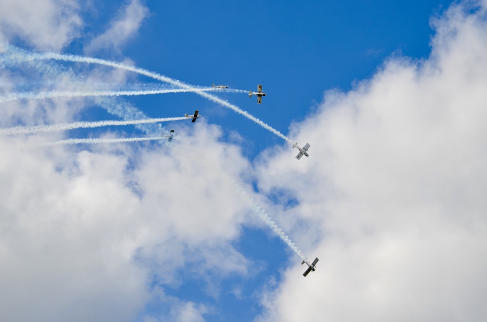 low angle photography of six fighter plane in the sky