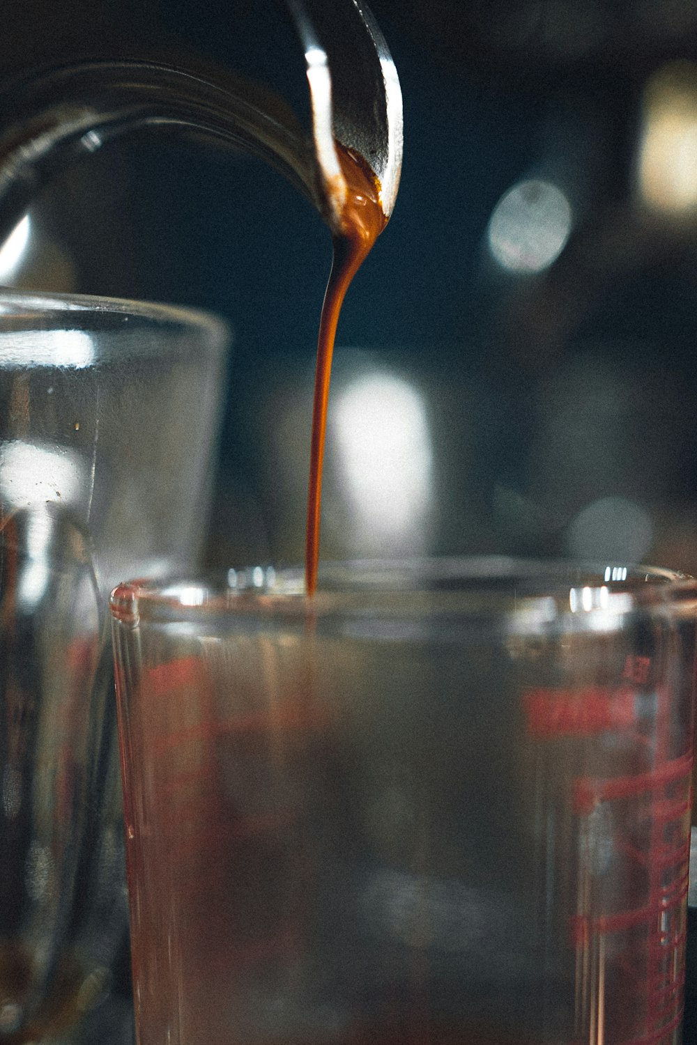 clear drinking glass with brown liquid