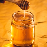 clear glass jar with brown liquid