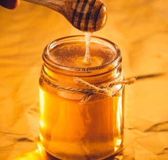 clear glass jar with brown liquid