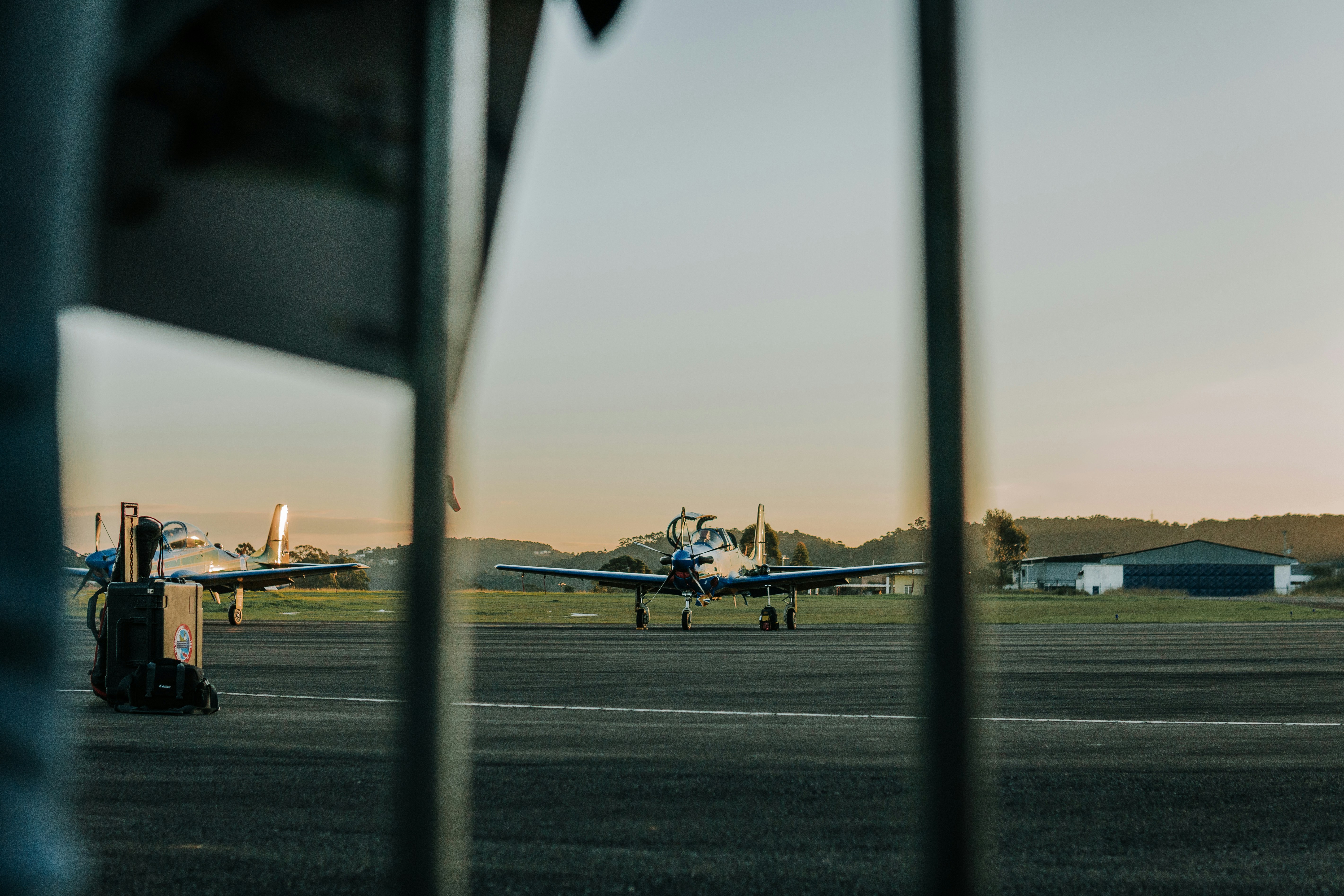 white and black plane on gray asphalt road during daytime, 