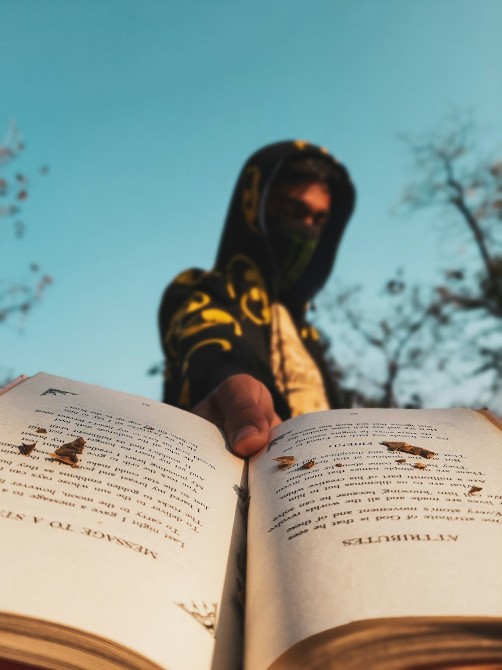 woman in black hijab reading book