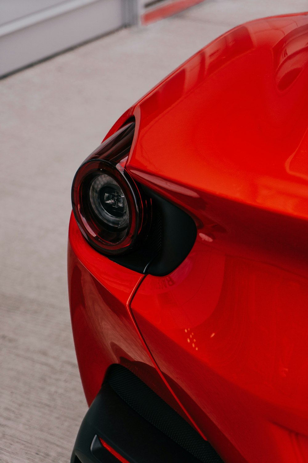 red ferrari car in close up photography