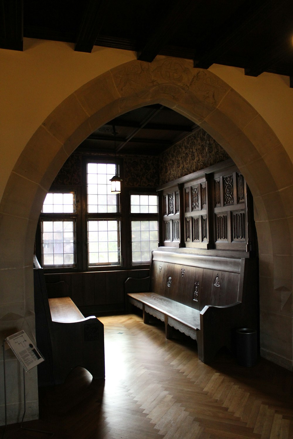 black wooden bed frame near window