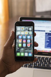 person holding space gray iphone 6