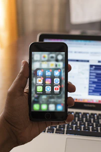 person holding space gray iphone 6