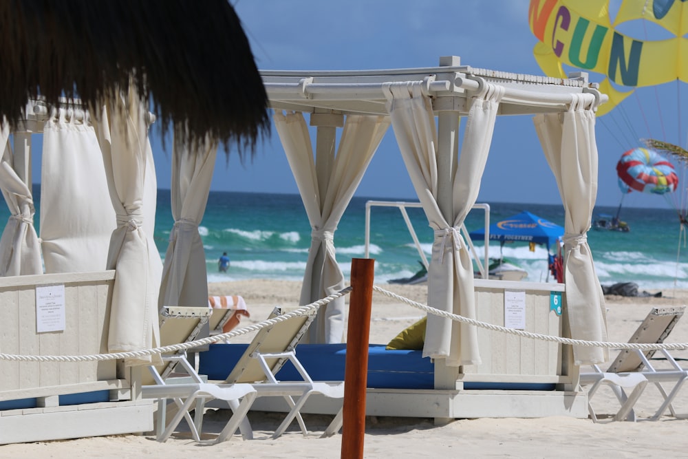 white and brown beach umbrellas on beach during daytime