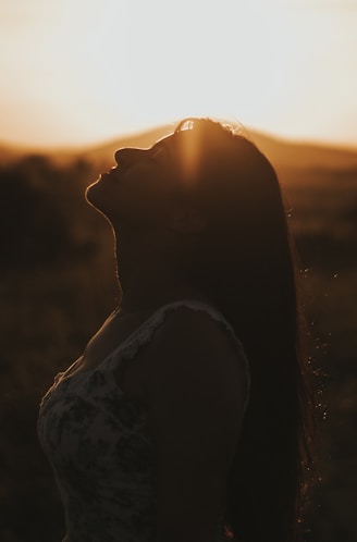 silhouette of woman during sunset