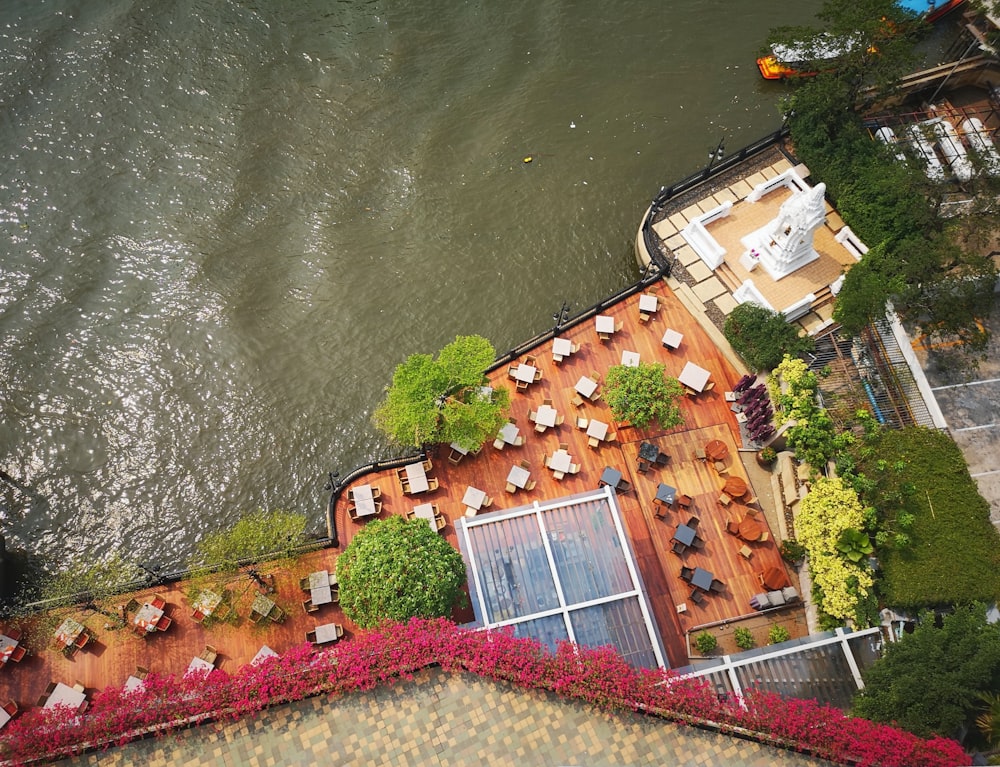 brown and white concrete building beside body of water during daytime