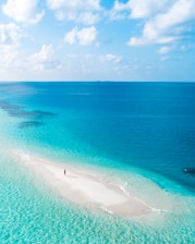 blue sea under blue sky during daytime