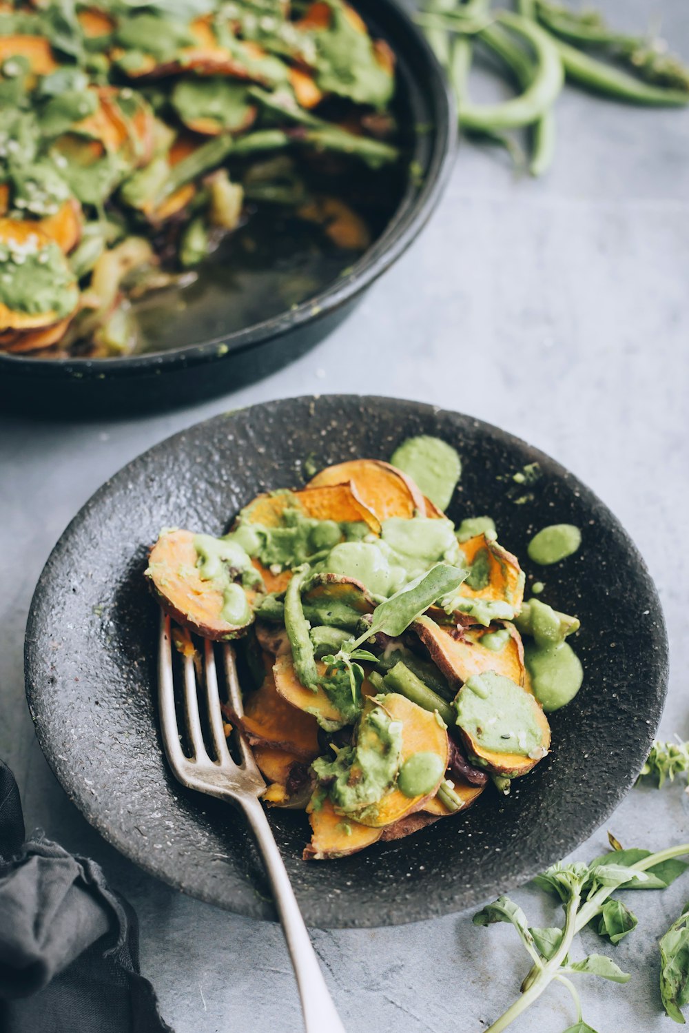 vegetable salad on black plate