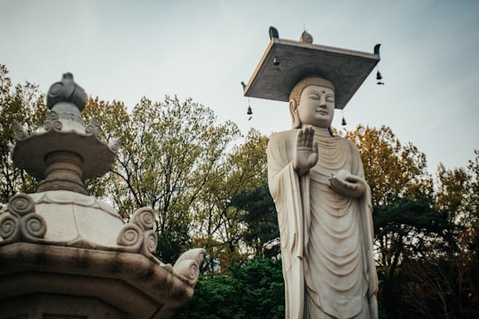 angel holding a cross statue in Bongeunsa South Korea
