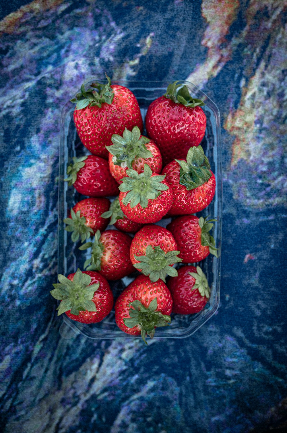 strawberries in clear plastic container