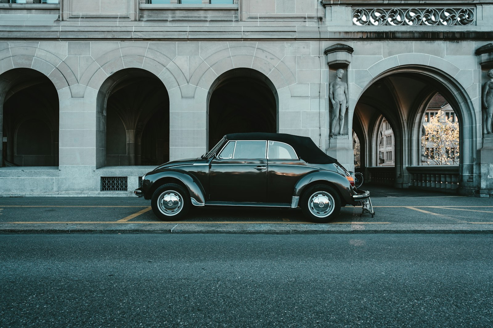 Sony FE 24mm F1.4 GM sample photo. Black car parked beside photography