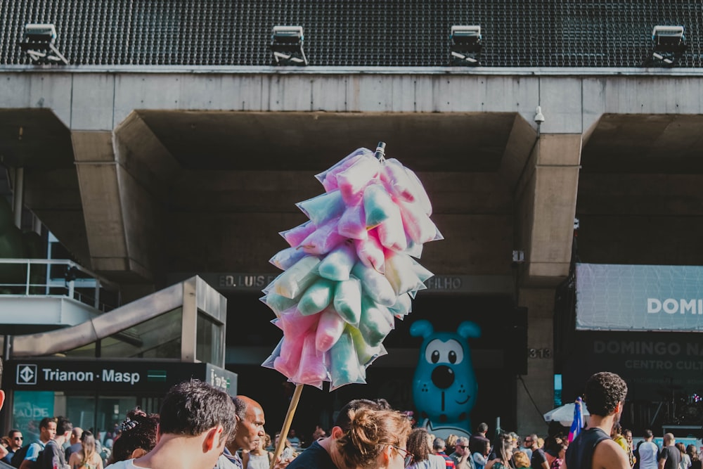 people holding pink umbrella during daytime