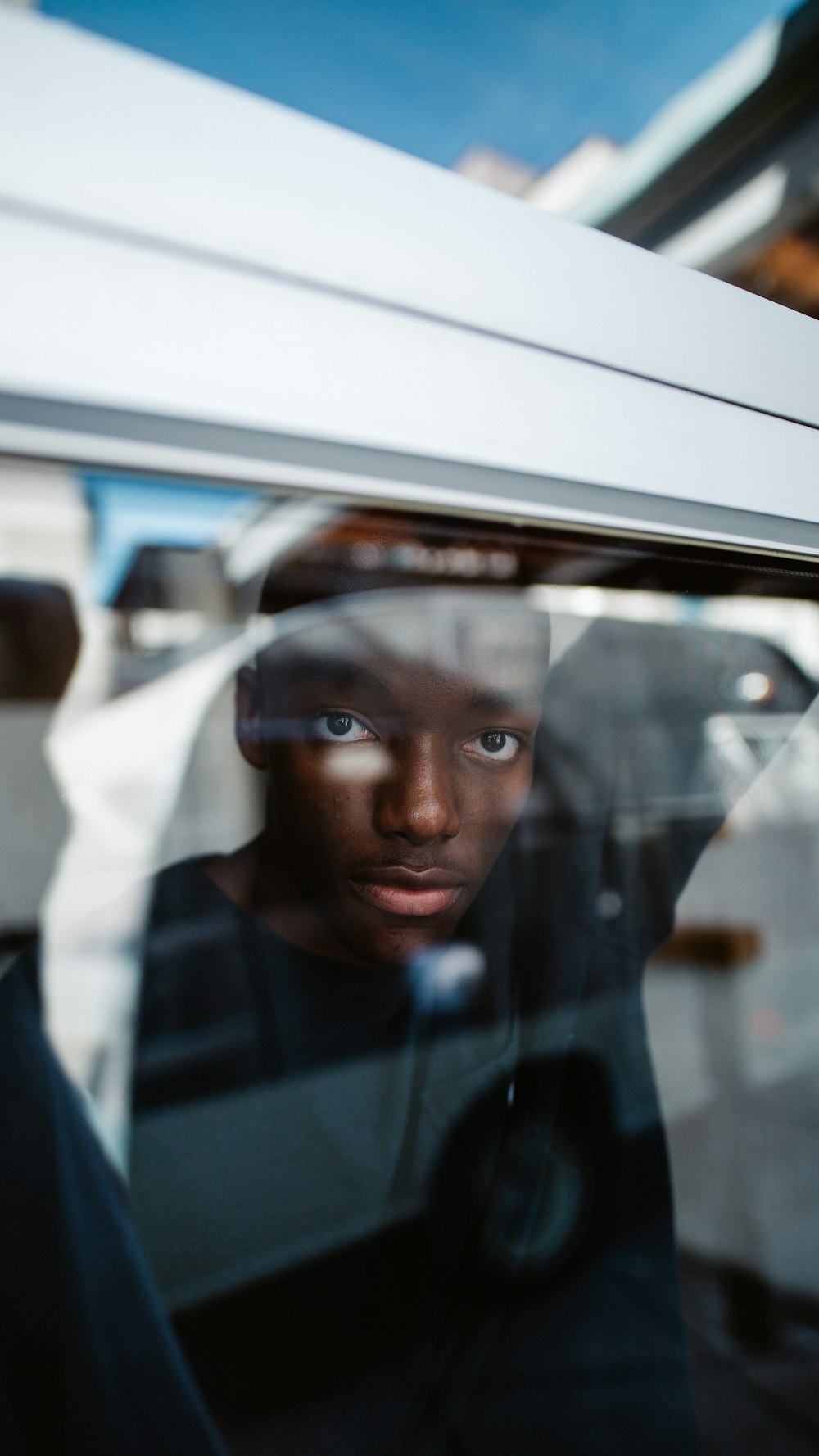 woman in white hijab inside car