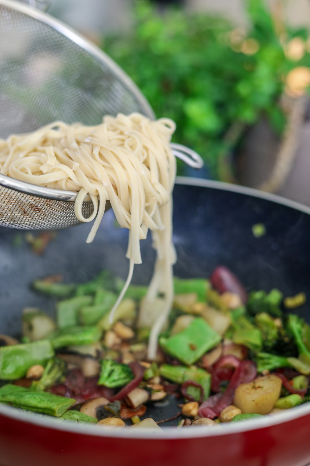 white pasta on stainless steel strainer
