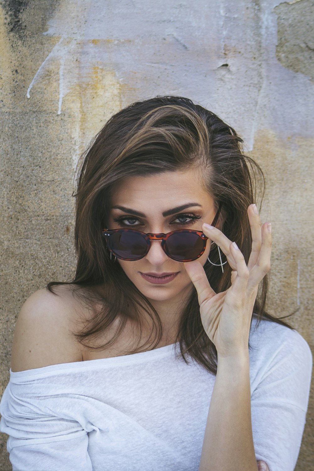 woman in white tank top wearing black sunglasses