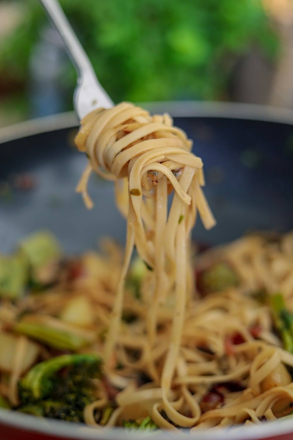 pasta dish on black round plate