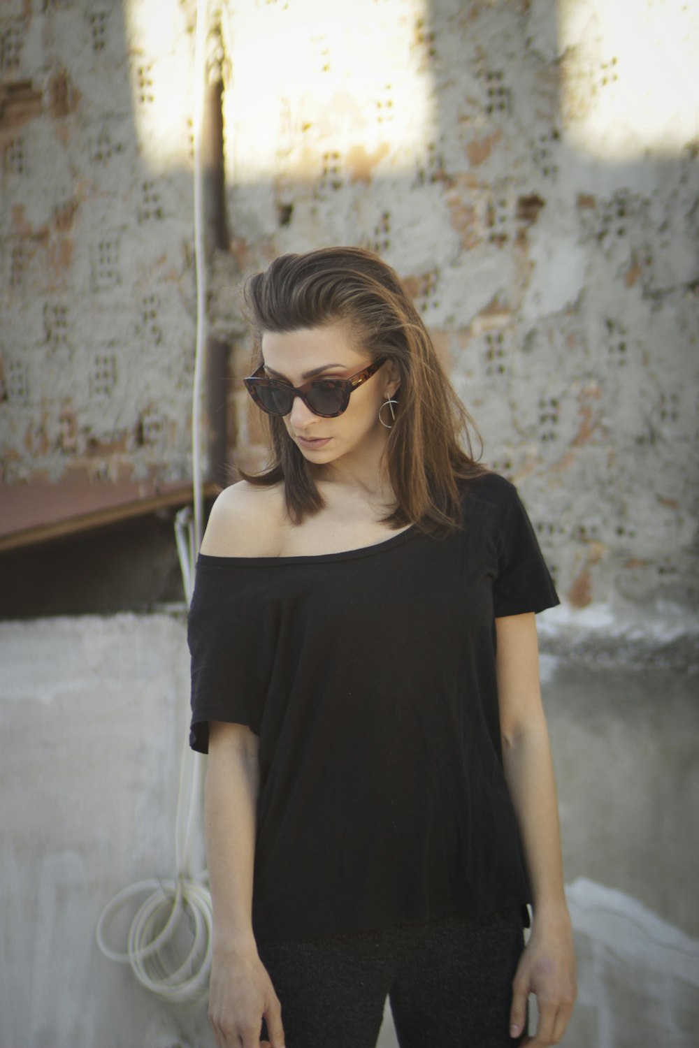 woman in black crew neck t-shirt wearing black sunglasses
