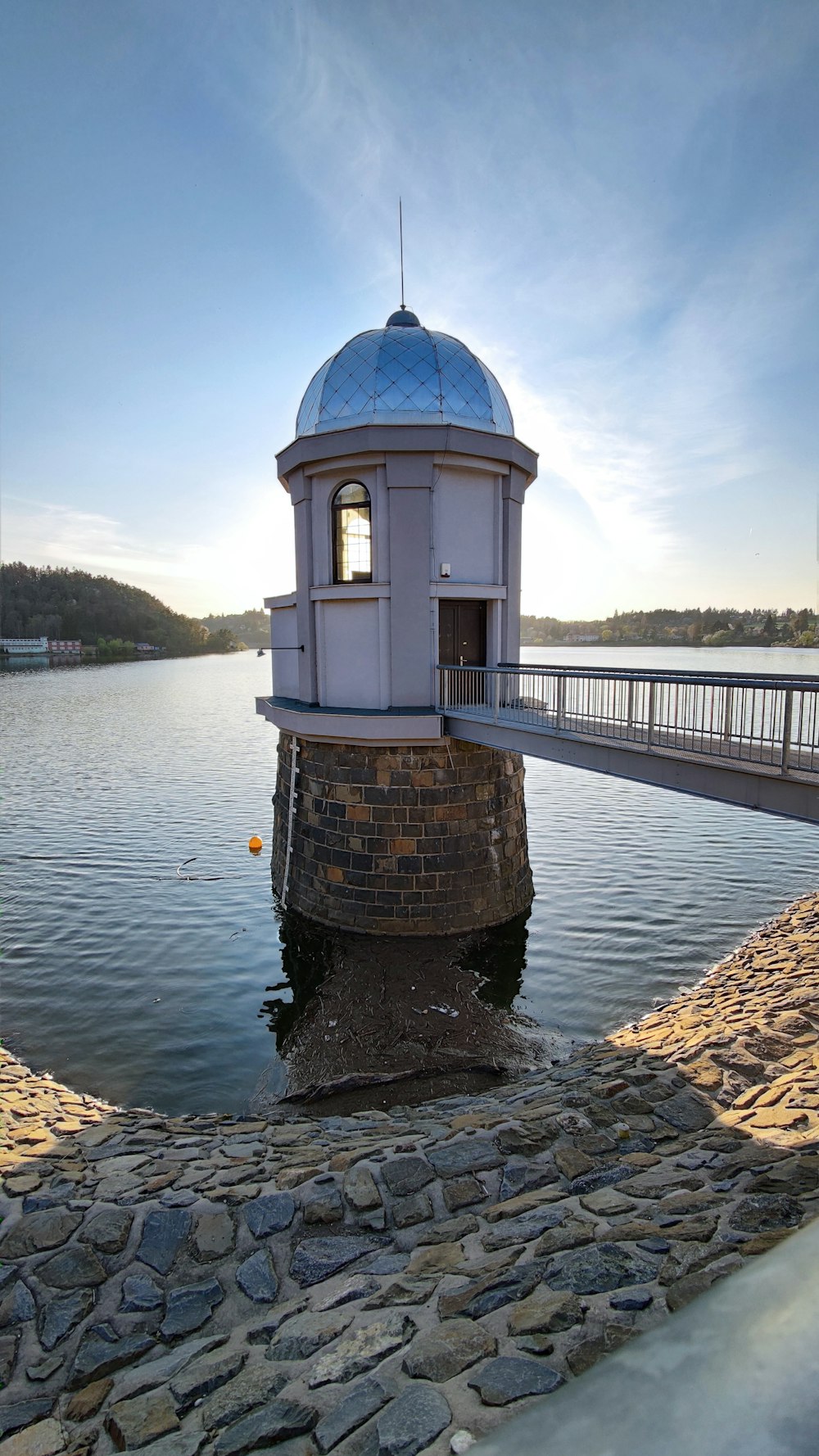 brown concrete building near body of water during daytime