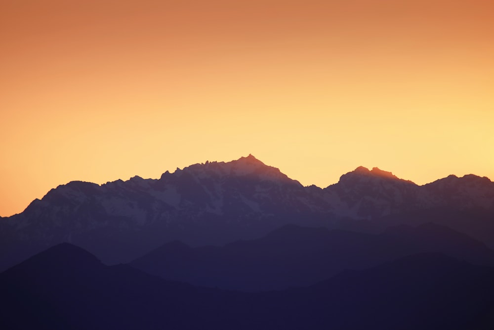 silhouette of mountains during sunset