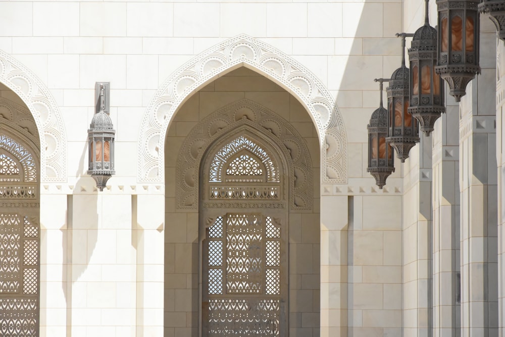 brown wooden door on white concrete building