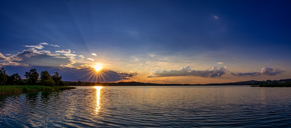 body of water during sunset