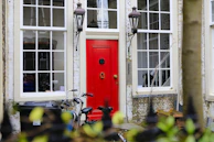 A vibrant red door showcasing a bold statement for a commercial storefront.