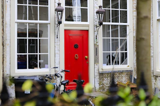 A vibrant red door showcasing a bold statement for a commercial storefront.