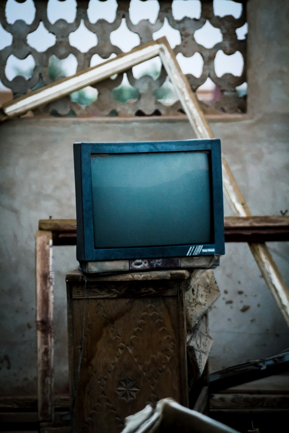 black crt tv on brown wooden table