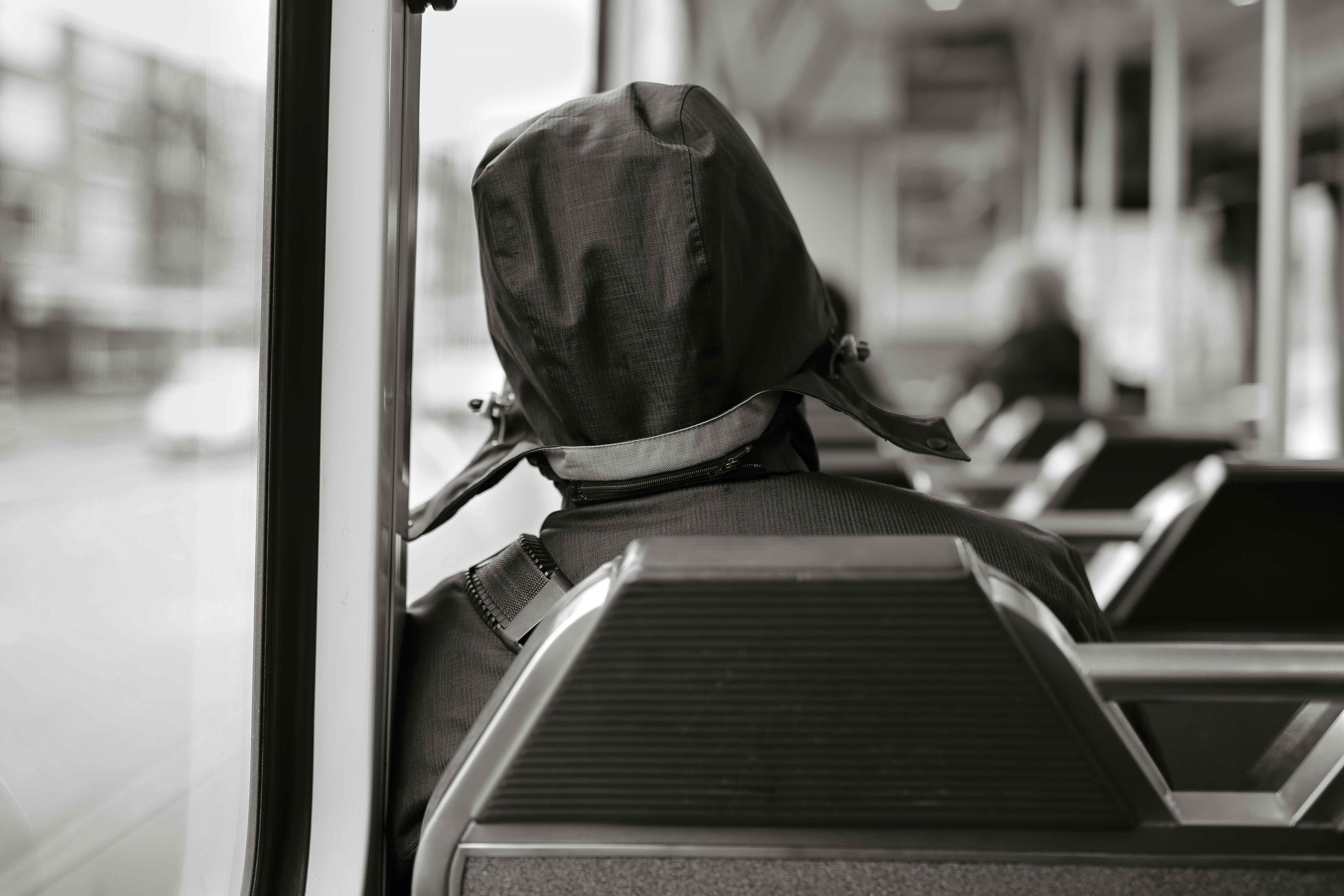 person in black leather backpack