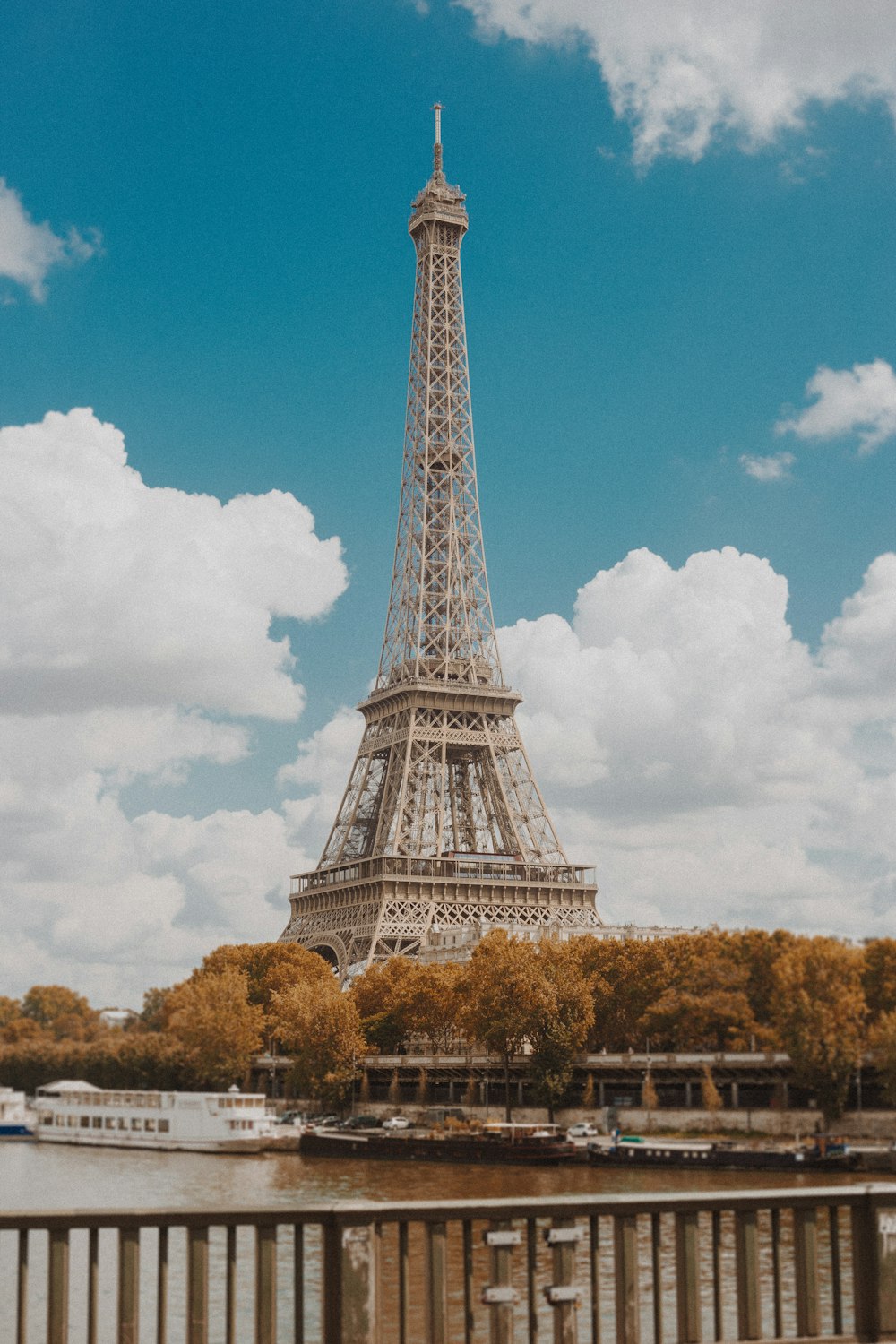 a view of the eiffel tower from across the river