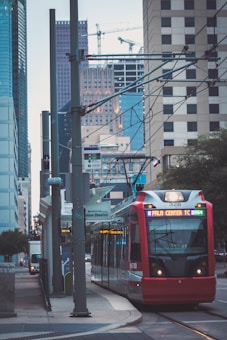 green and yellow tram on road during daytime