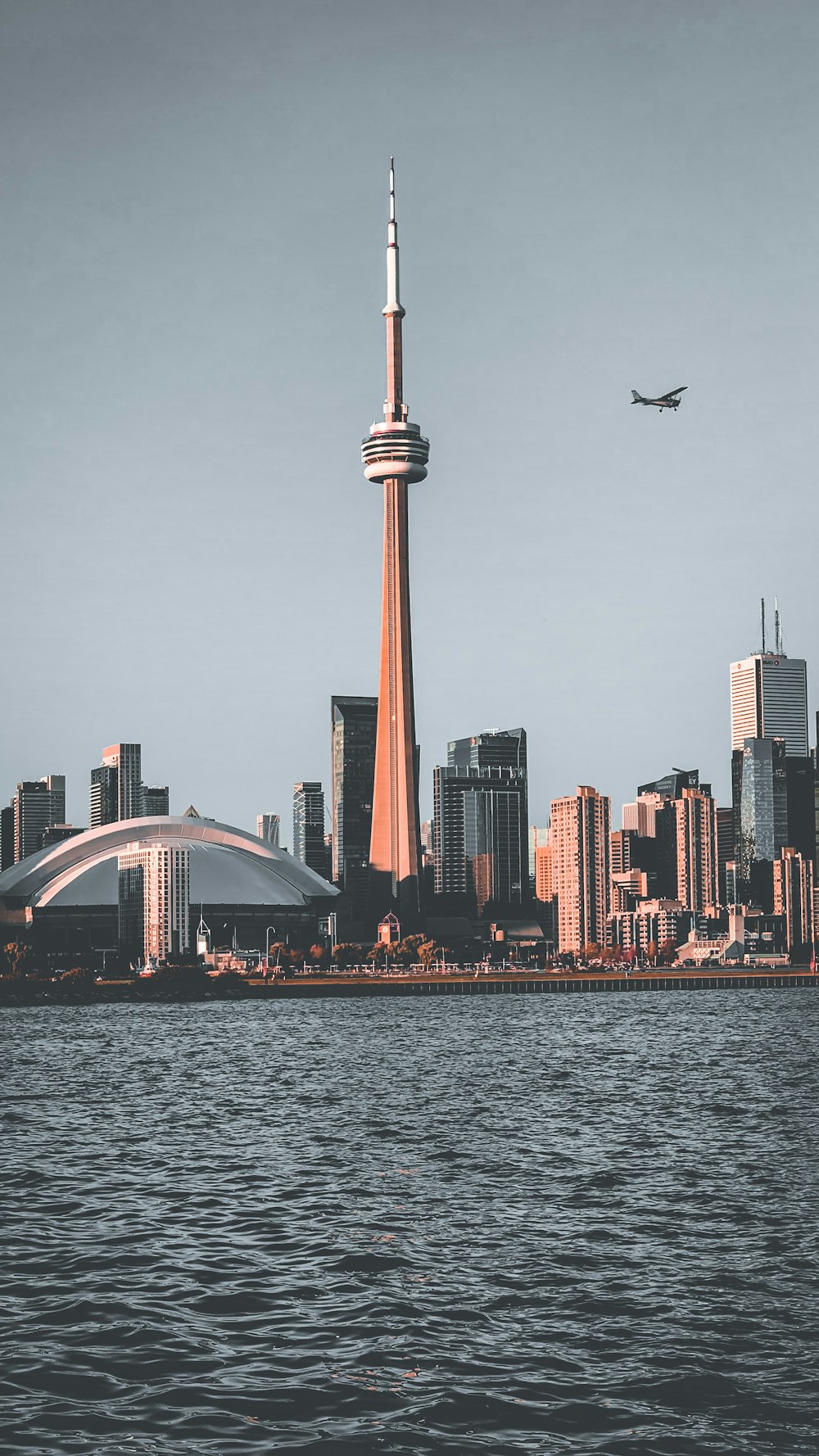 high rise buildings near body of water during daytime