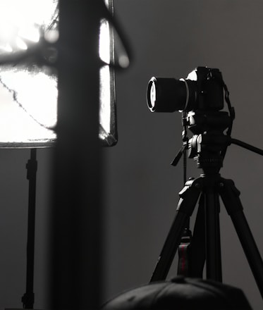 A modern photography studio with soft lighting and professional equipment.