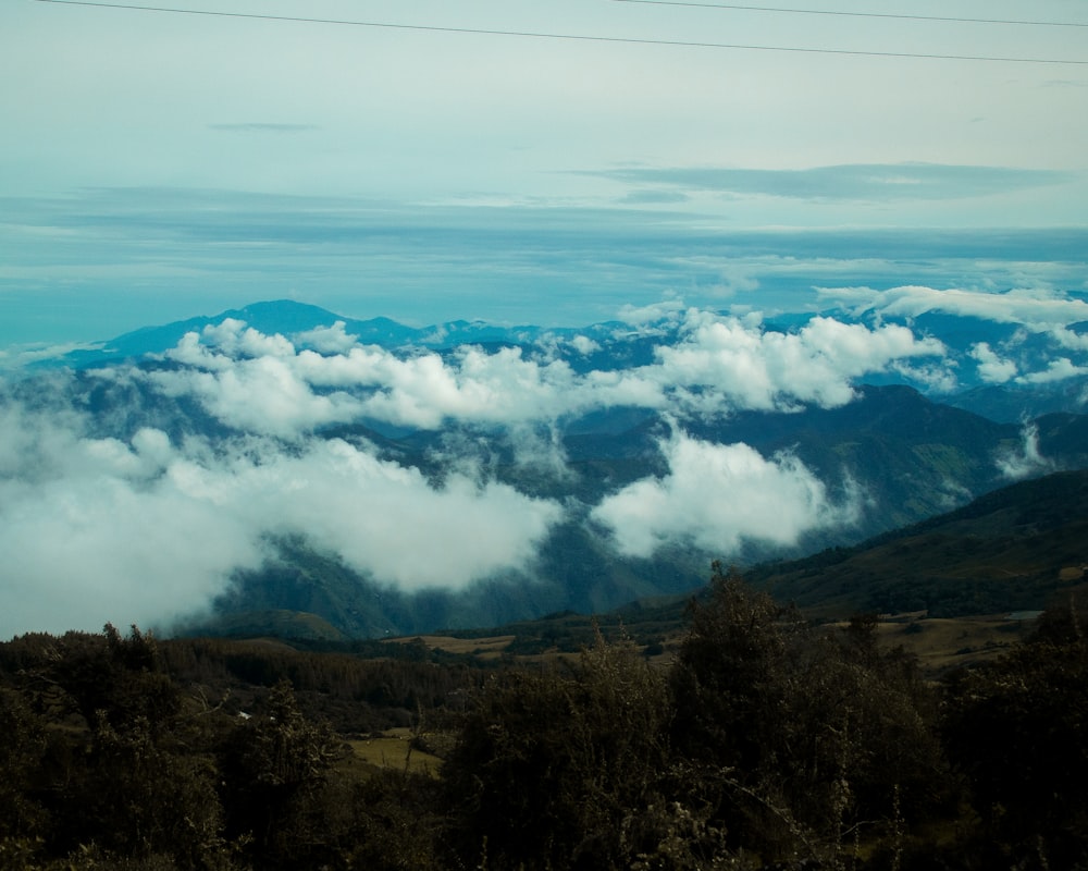 green mountains under white clouds during daytime