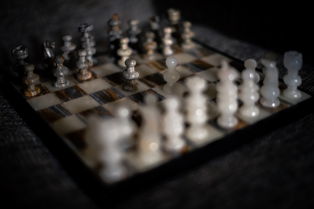 white and black chess pieces on chess board